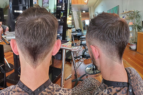 Man in salon after having a Fade hair cut