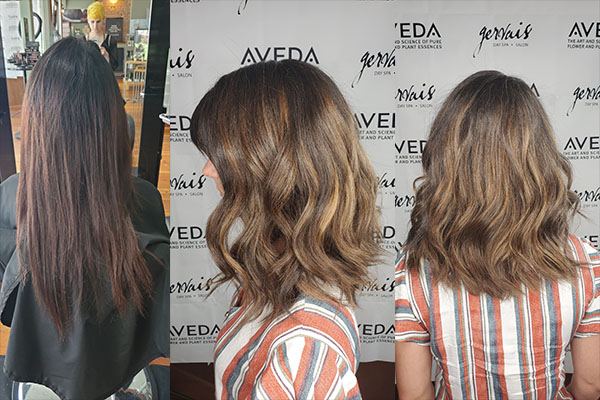 Girl getting her hair Shortened and styled in front of Aveda wall