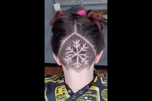 Girl with snowflake Hair Tattoo Cut