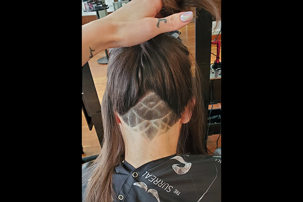 Long hair girl with Hair Tattoo Cut